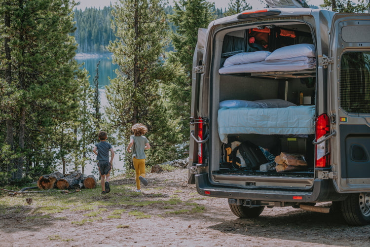 Kids playing near the back of an Adventure Wagon Van