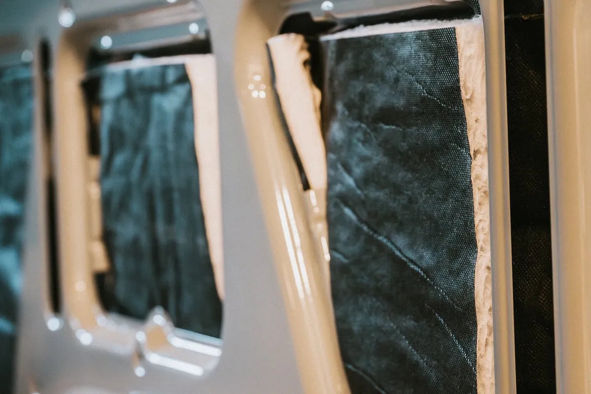 Adventure Wagon Factory Install insulation fitted inside the exposed walls of a camper van before the finished Interior System panels are added.