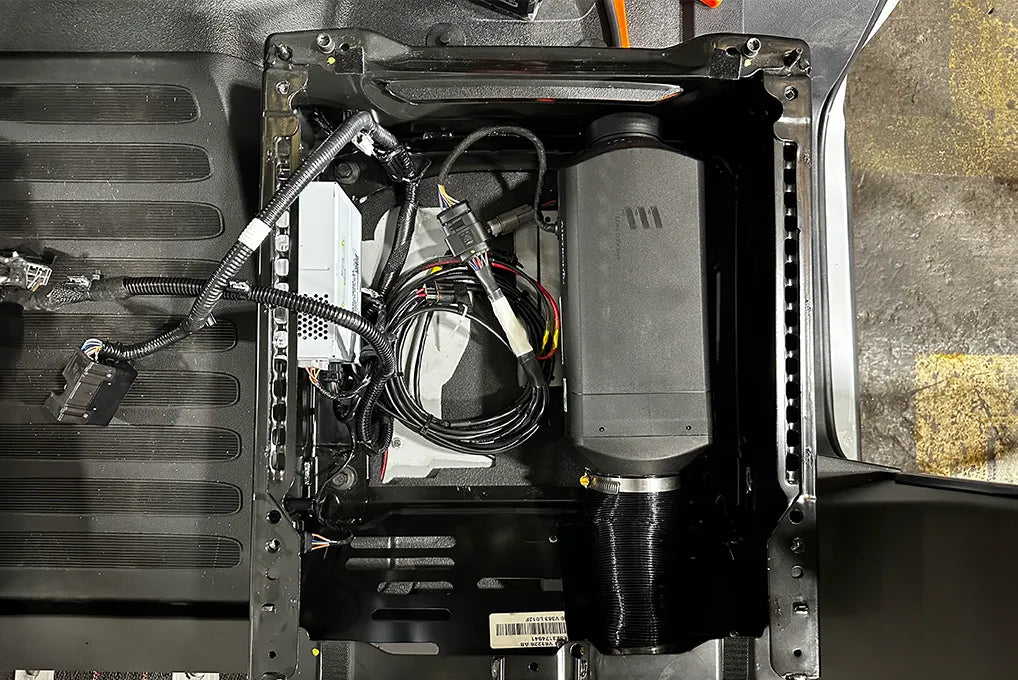 Adventure Wagon Factory Install of an Espar heater system inside a camper van for reliable all-season interior heating.