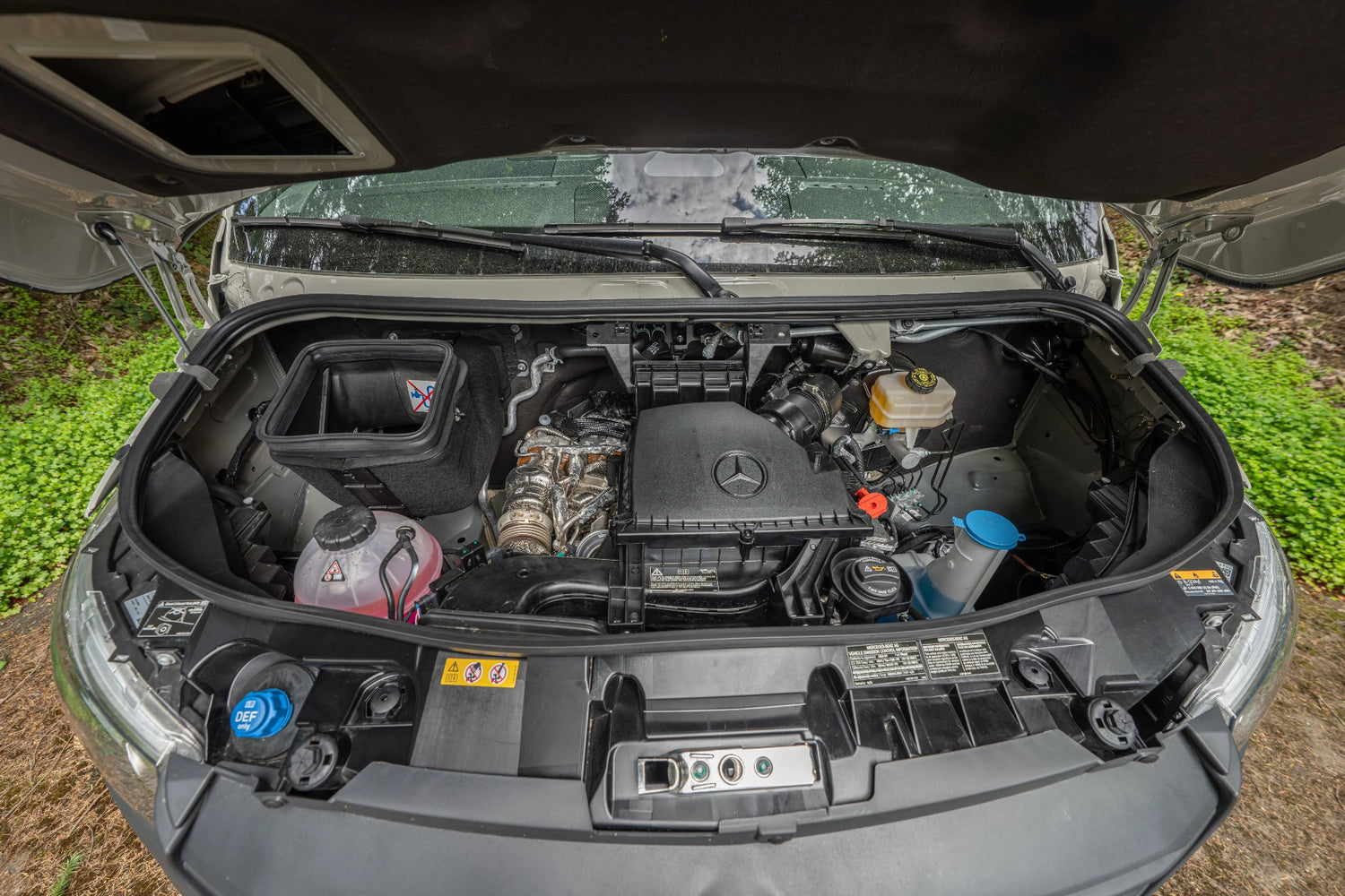 Adventure Wagon Guided Build 538 Mercedes Sprinter engine bay with hood open.