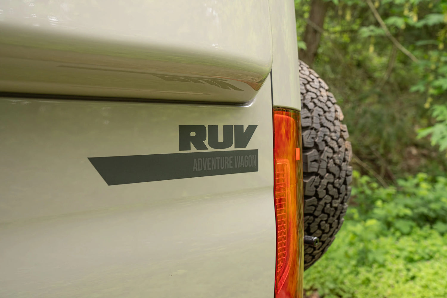 Adventure Wagon Guided Build 538 RUV exterior logo detail beside the rear spare tire.