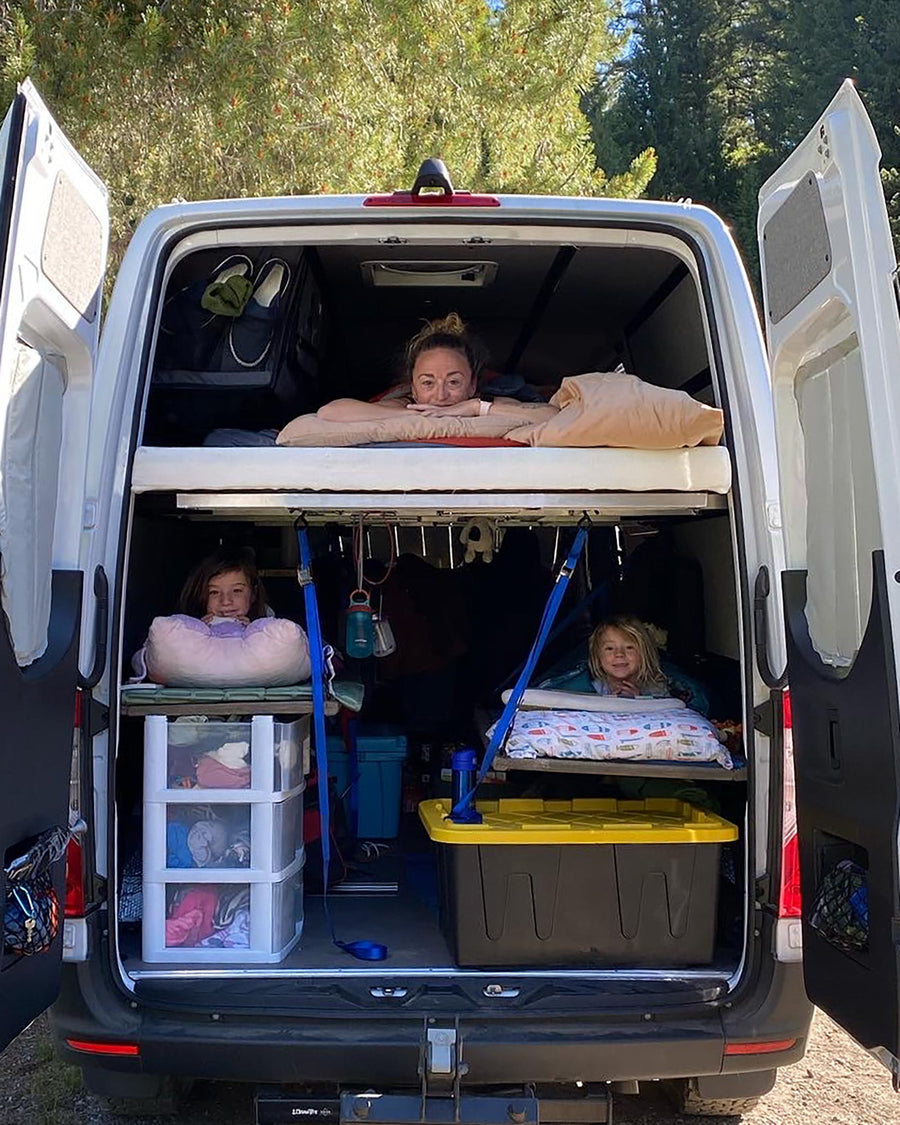 Interior of a converted sprinter van showcasing a potential sleeping quarters 